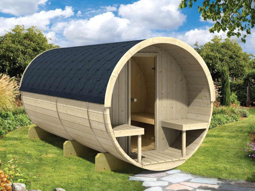 large wood fired timber barrel sauna in garden