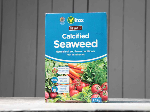 Calcified seaweed soil conditioner box from front on bench