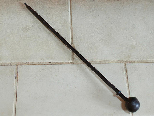 wrought iron fireplace poker with a ball handle