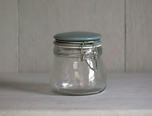 small glass storage jar with hinged lid