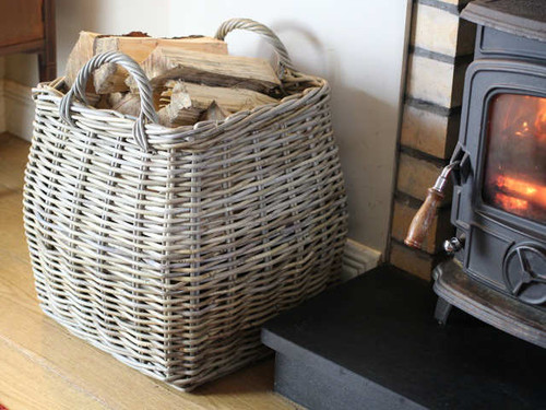 Tapered log basket by the stove
